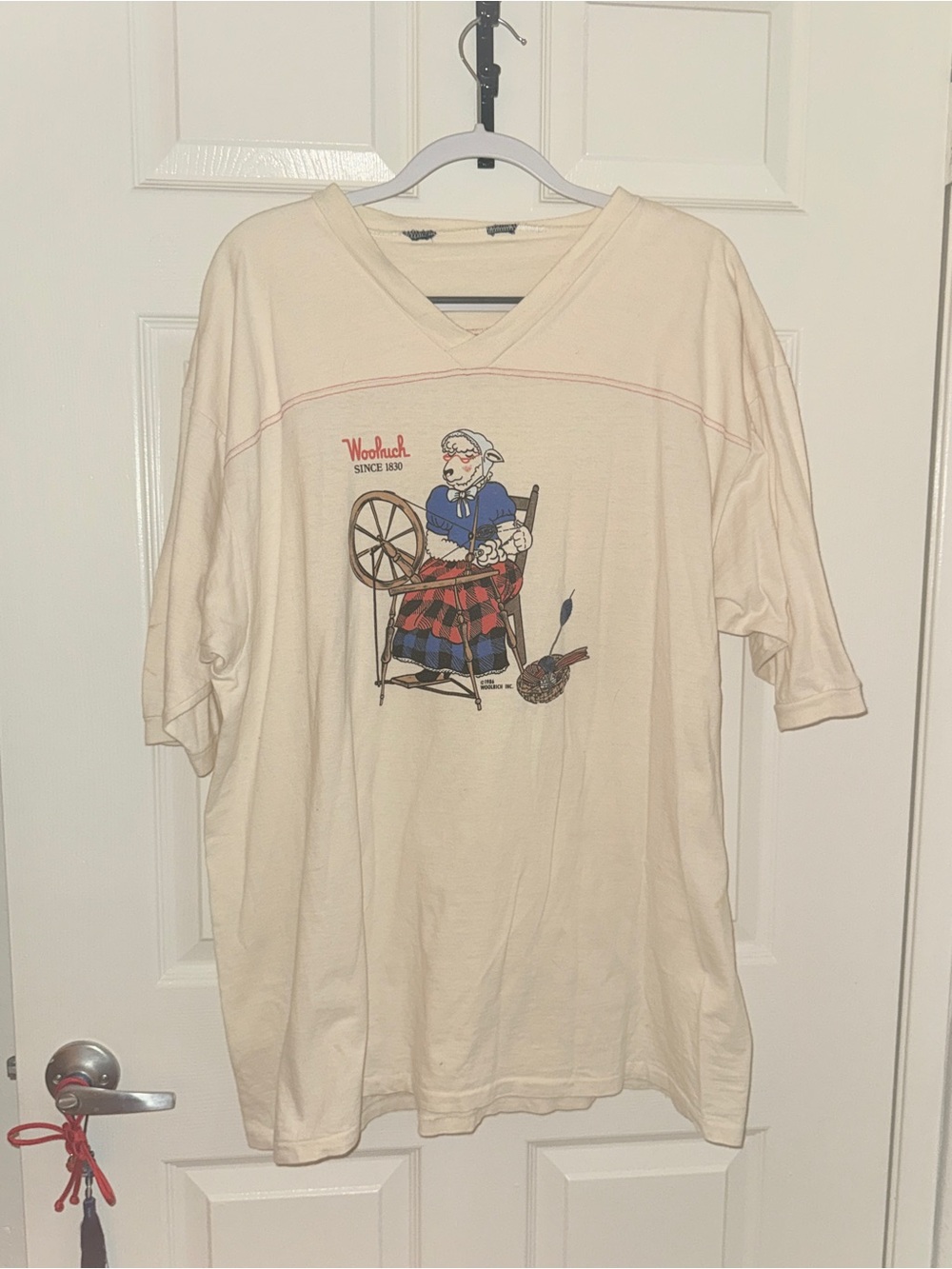 Woolrich Cream Short Sleeve V-Neck Tee with Spinning Wheel Graphic
